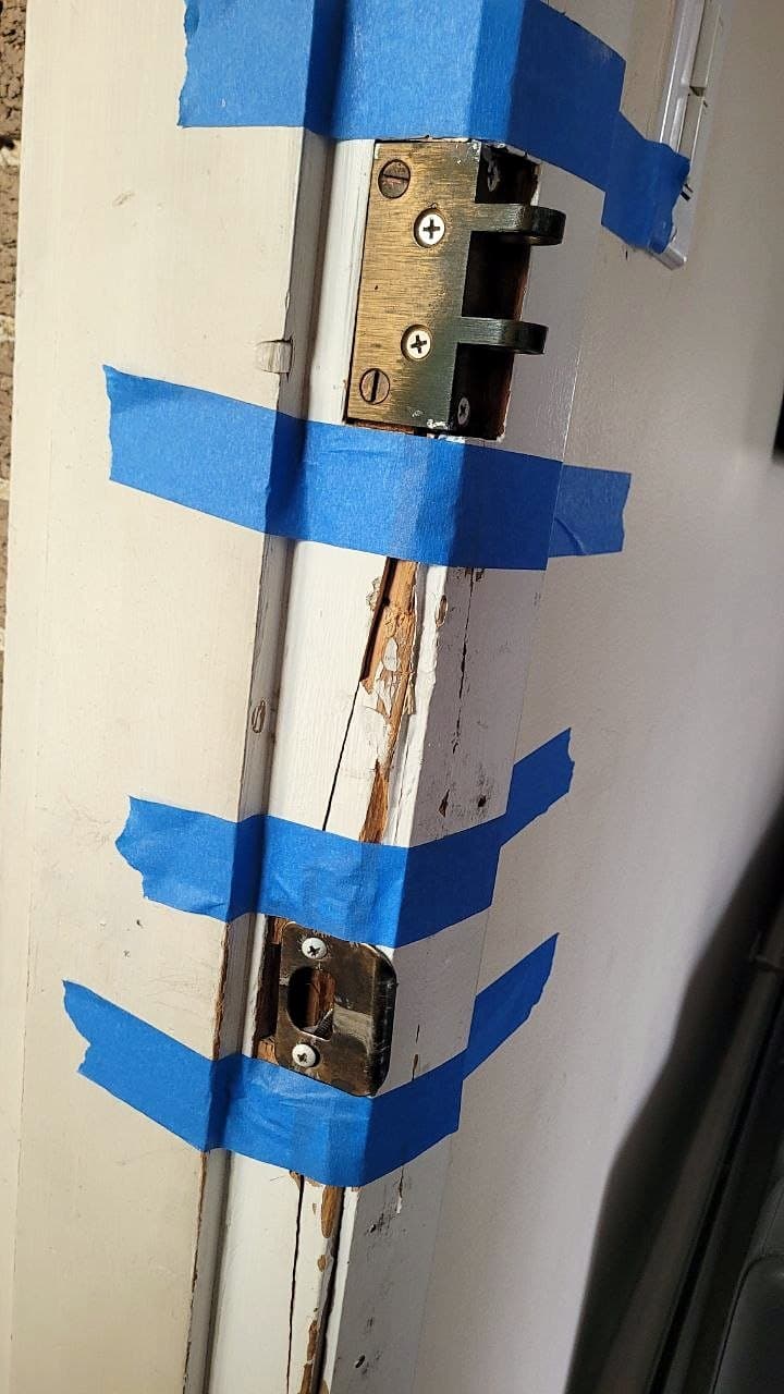 Before: Door jamb split and splintered around the strike plates