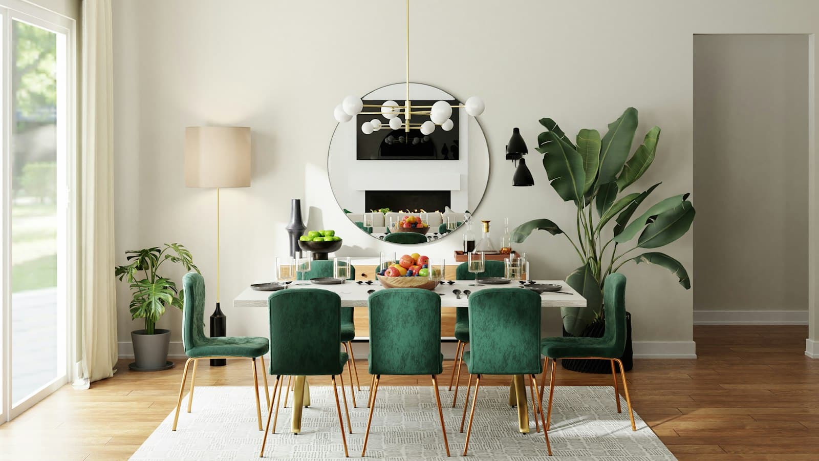 Dining room with a round mirror, green velvet chairs, and a fireplace